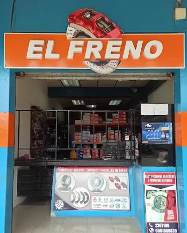 Fachada de El Freno vista desde la calle, con el letrero naranja sobre la entrada.